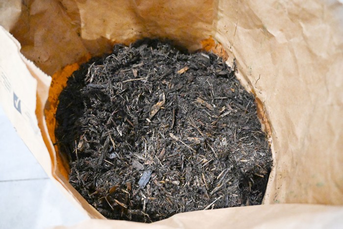 This photo shows a bag of the media (carboxymethylcellulose–iron) dried on Cedar bark.