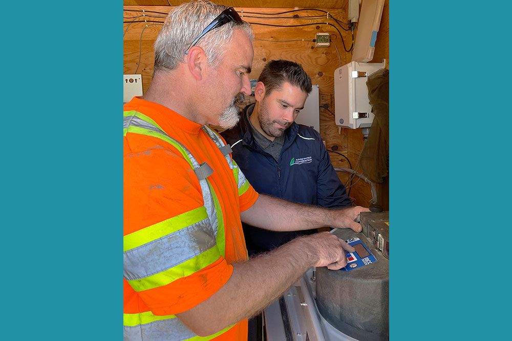 Derek Smith (MECP) and Tommy Kokas (ABCA) collect data about the response of water conditions to weather and the landscape.